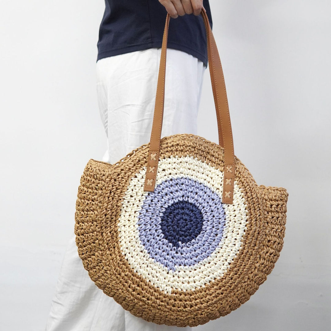 Braided basket bag with unique round design and elegant shoulder straps Stornfield