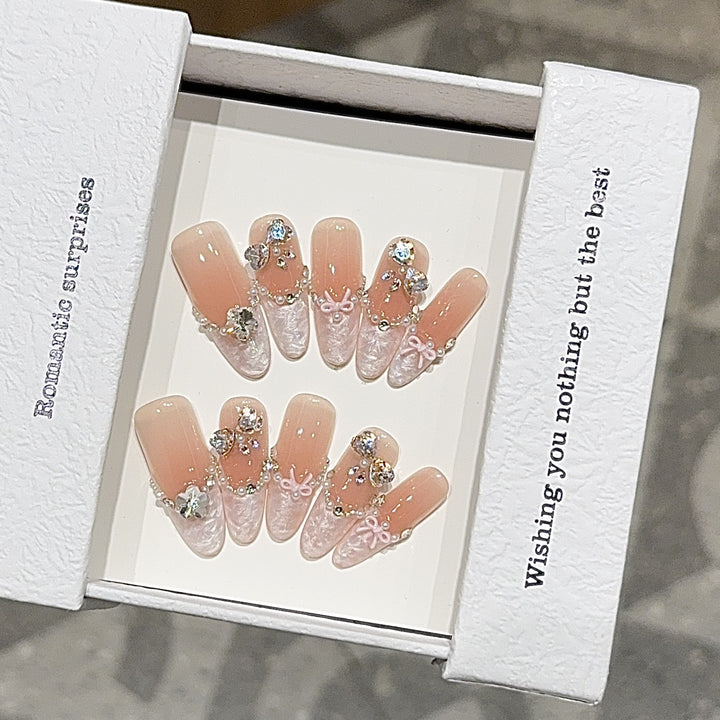 Artificial nails with romantic rhinestone details Stornfield
