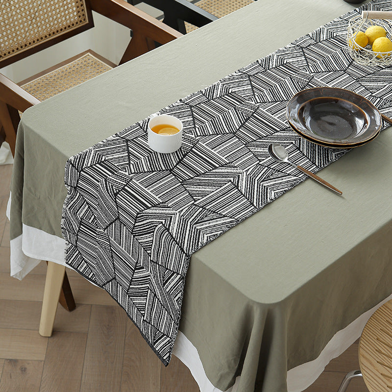 Woven table runner in graphic block stripe design with light cotton texture