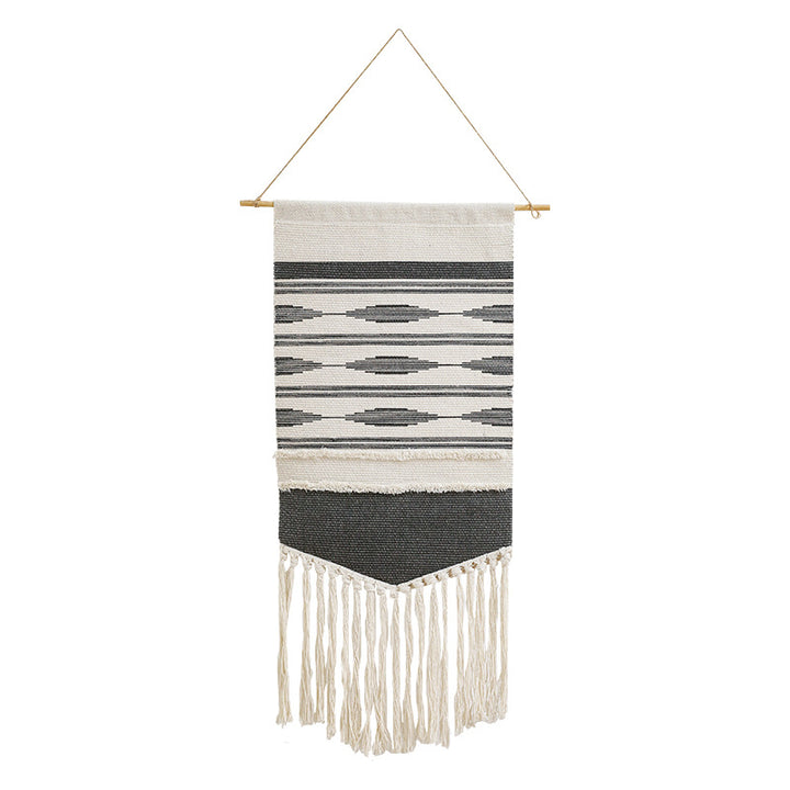 Handwoven wall hanging made of cotton blend with layered textures, wood rod and long fringes Stornfield