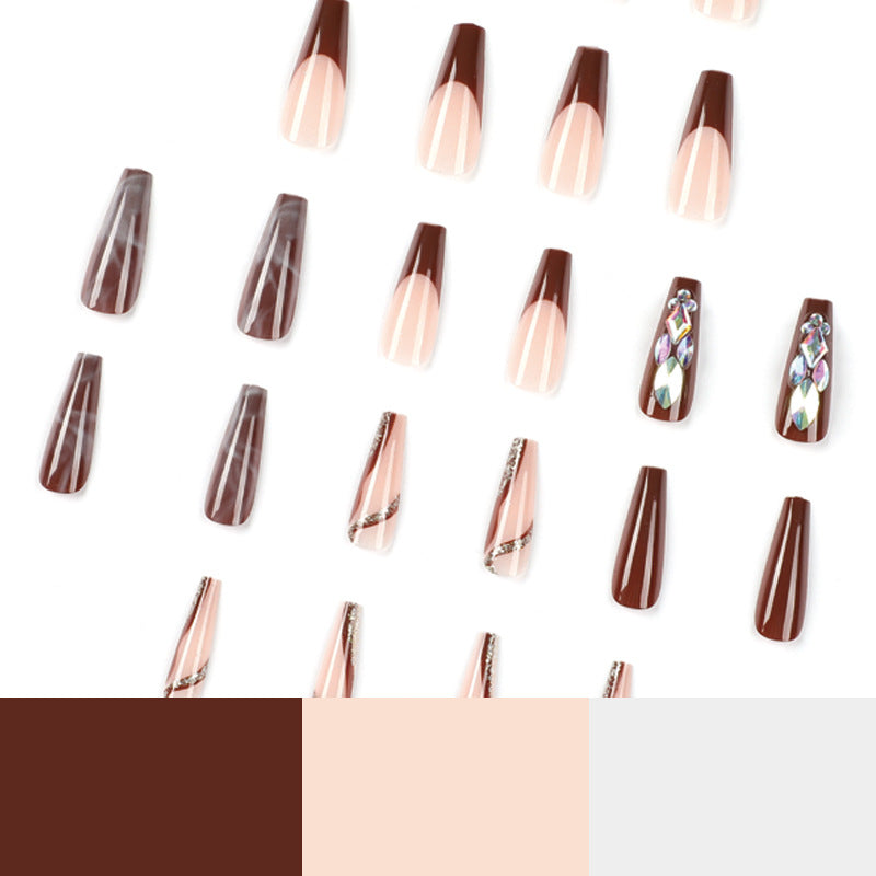 Artificial nail extensions with elegant gemstone embellishments Stornfield