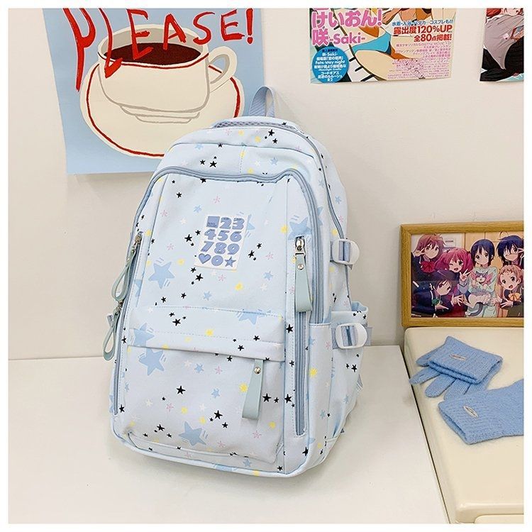 Playful backpack with star motifs and practical functions Stornfield