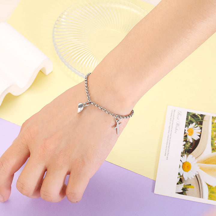 Versatile bracelet with cross and heart pendants Stornfield
