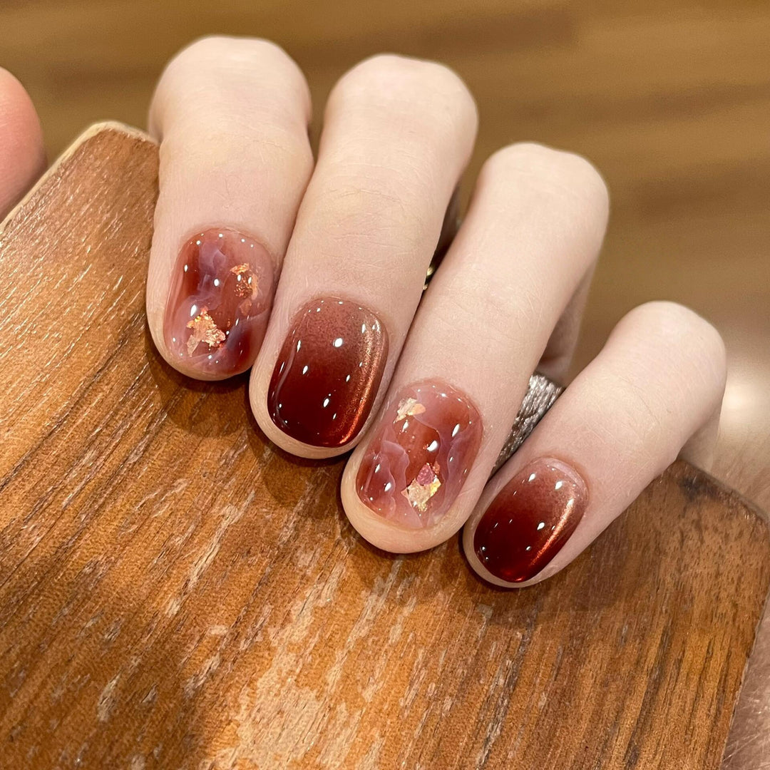 Artificial nails with elegant gradient and golden accents Stornfield