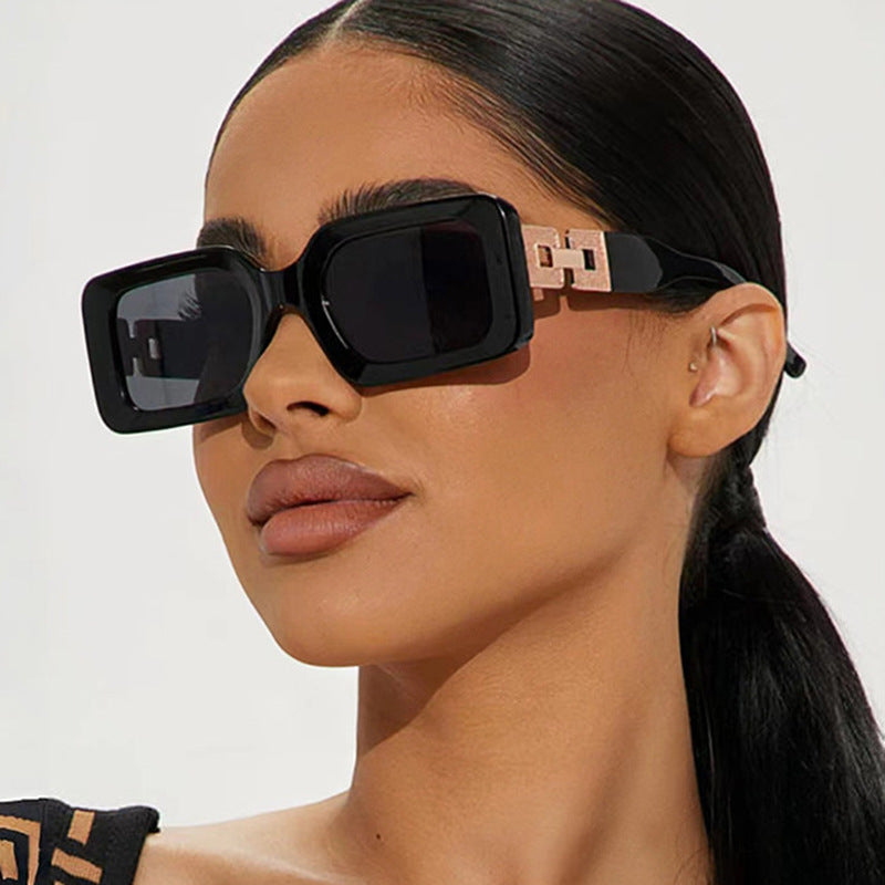 Women’s fashionable sunglasses in elegant square design with luxurious golden accents Stornfield