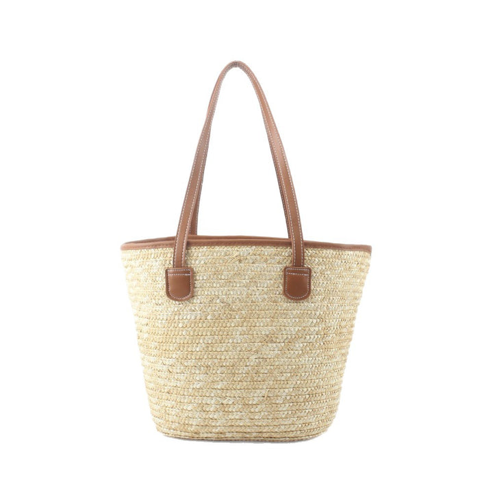 Braided basket bag with elegant leather handles Stornfield
