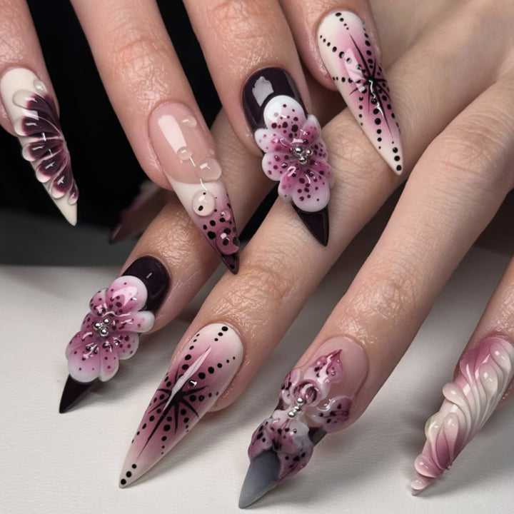 Artistic stiletto nails with floral 3D embellishments Stornfield