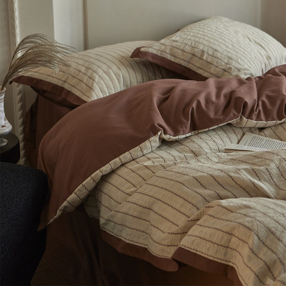 Luxurious cotton bedding set with ruffled trim and pillowcases
