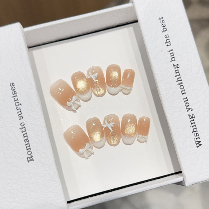 Artificial nails with romantic bow and glitter effects Stornfield