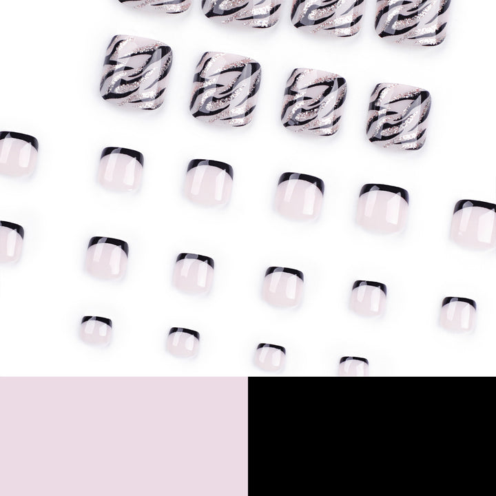 Artificial toenail art in elegant black and white design Stornfield