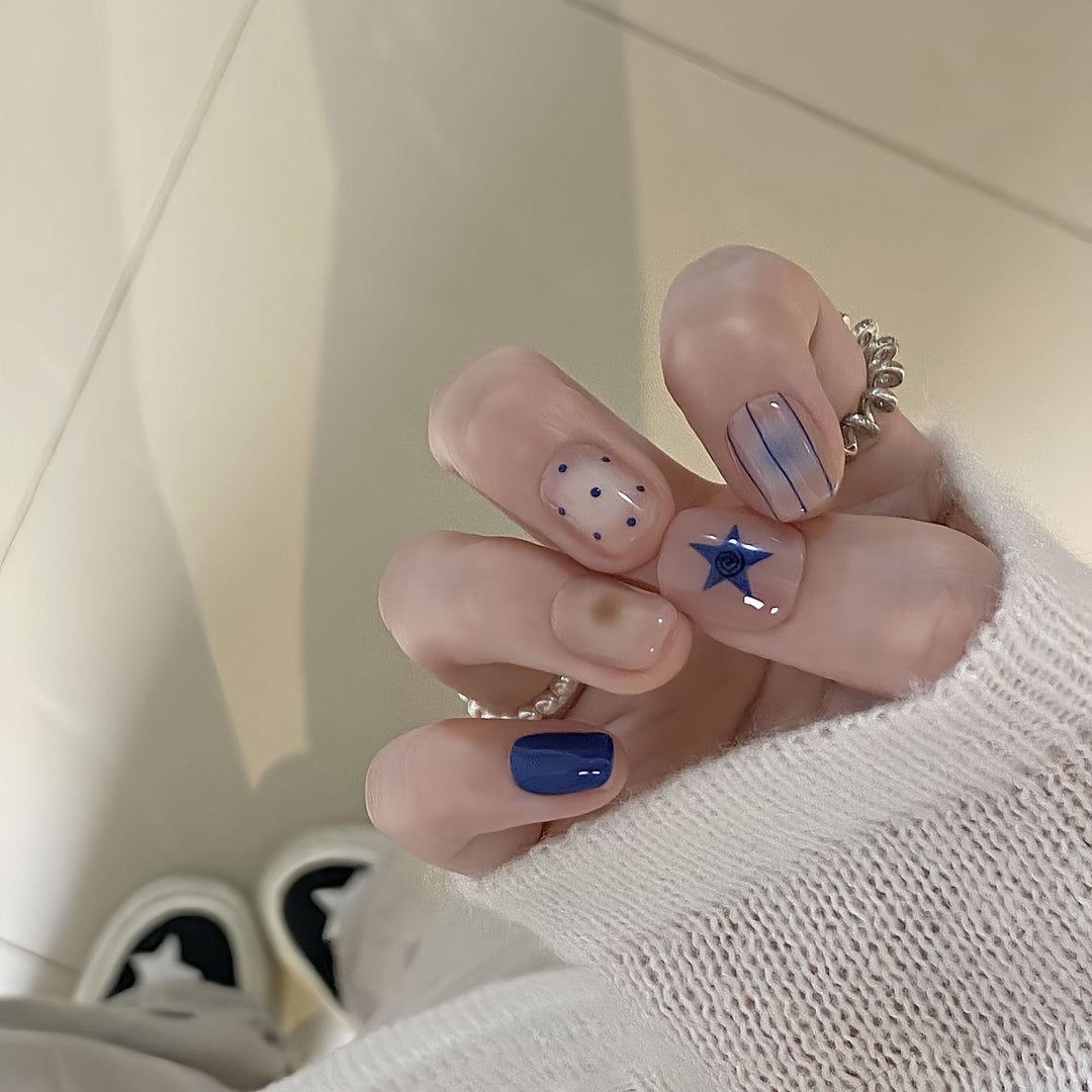 Artificial nails in modern design with geometric and sparkling accents Stornfield