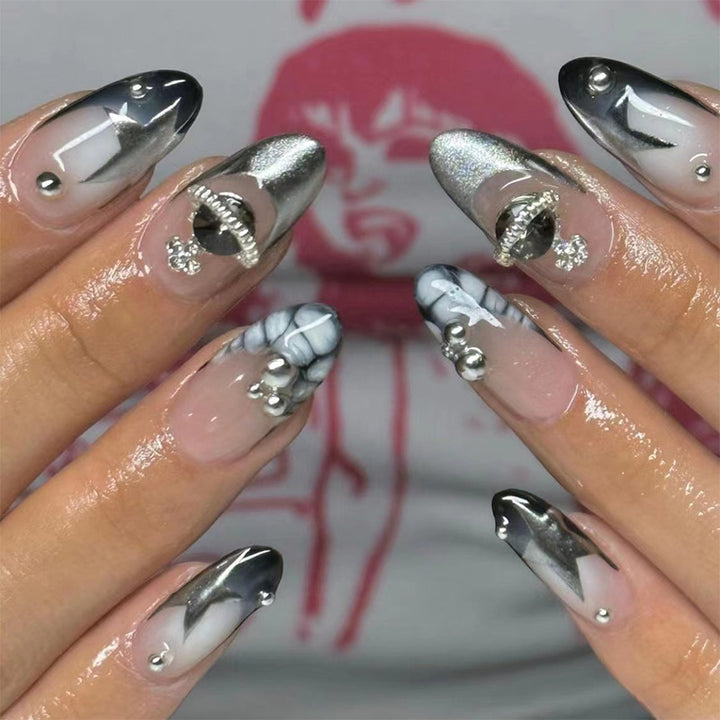 Artful acrylic nails with elegant 3D decorations and glitter effects Stornfield