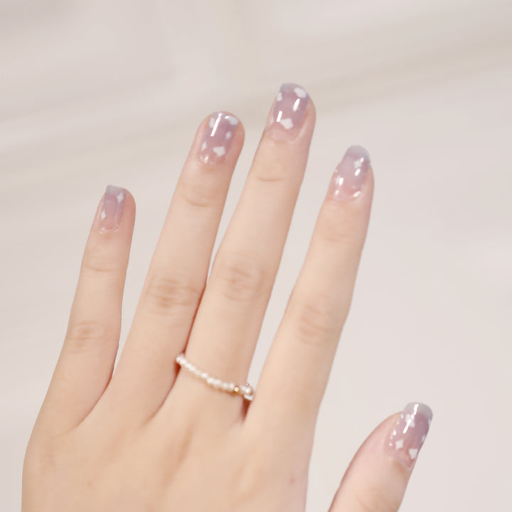 Artificial nail art with heart-shaped designs and soft color gradients Stornfield