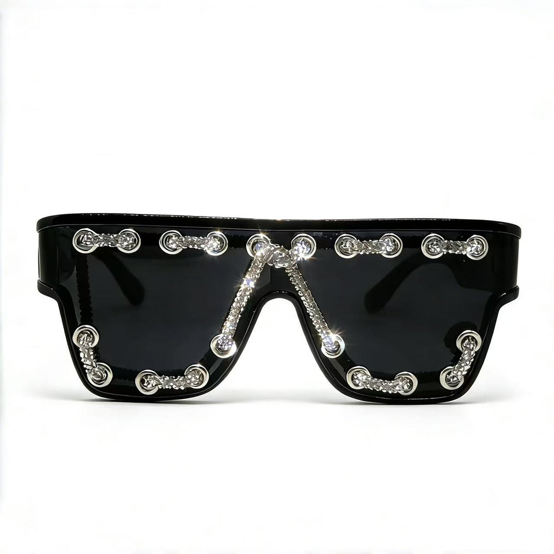 Ladies sunglasses with extravagant design and decorative chain embellishment Stornfield