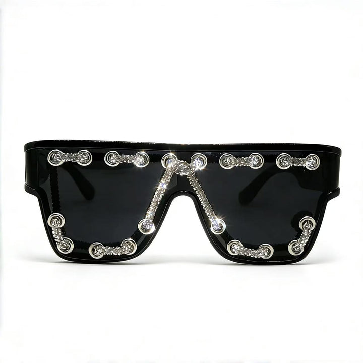 Ladies sunglasses with extravagant design and decorative chain embellishment Stornfield