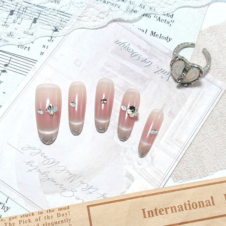 Glamorous artificial nails with rhinestone decorations Stornfield