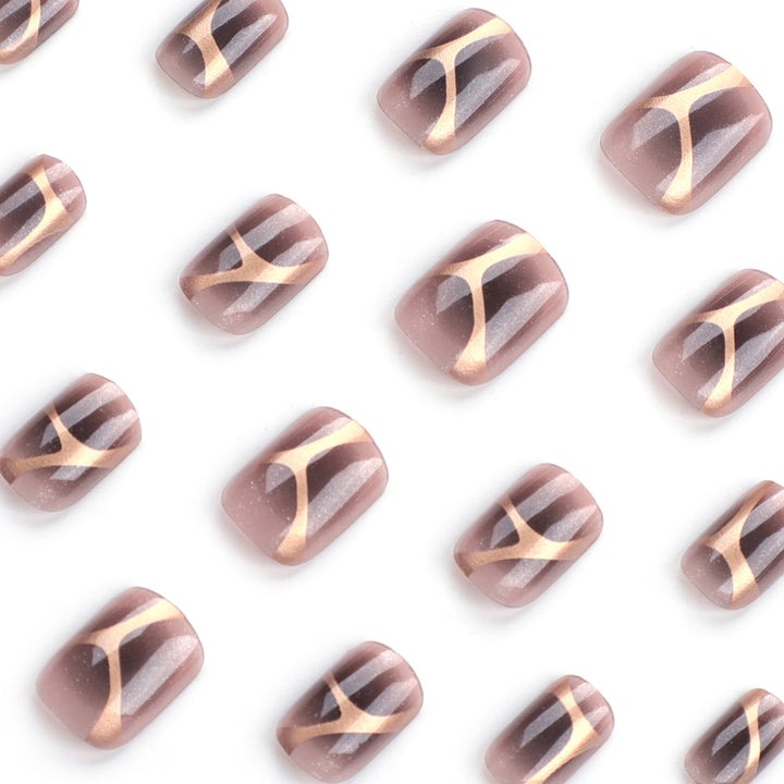 Artificial nail art with elegant metallic design and glitter accents Stornfield
