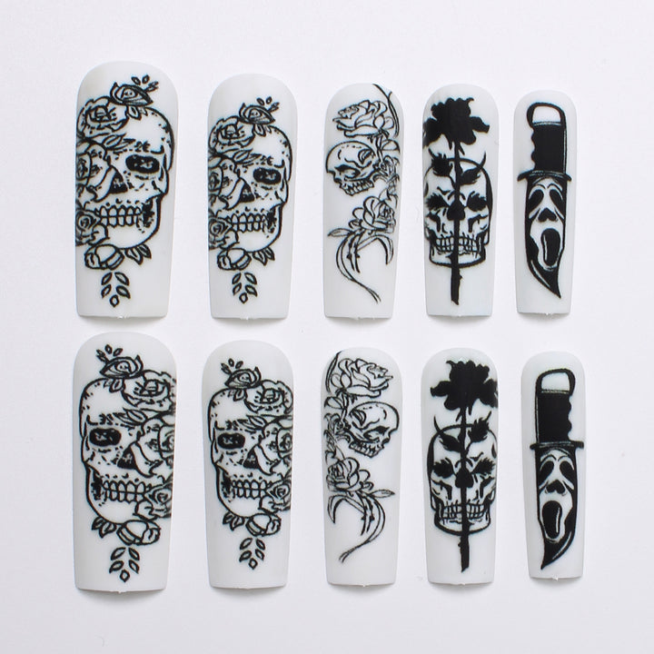 Nail set with spooky skull design and floral motifs Stornfield