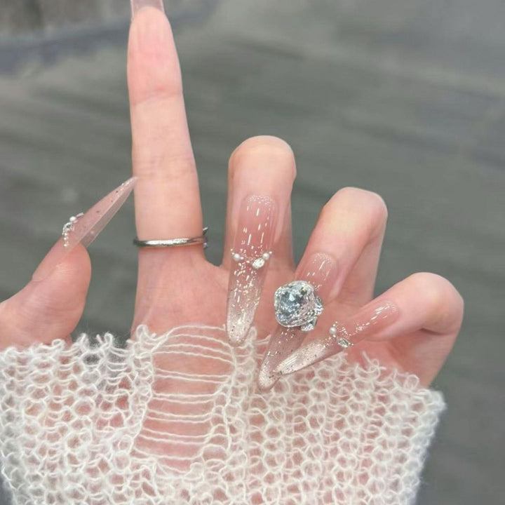 Artistic Stiletto Press-On Nail Art with Glimmering Accents Stornfield