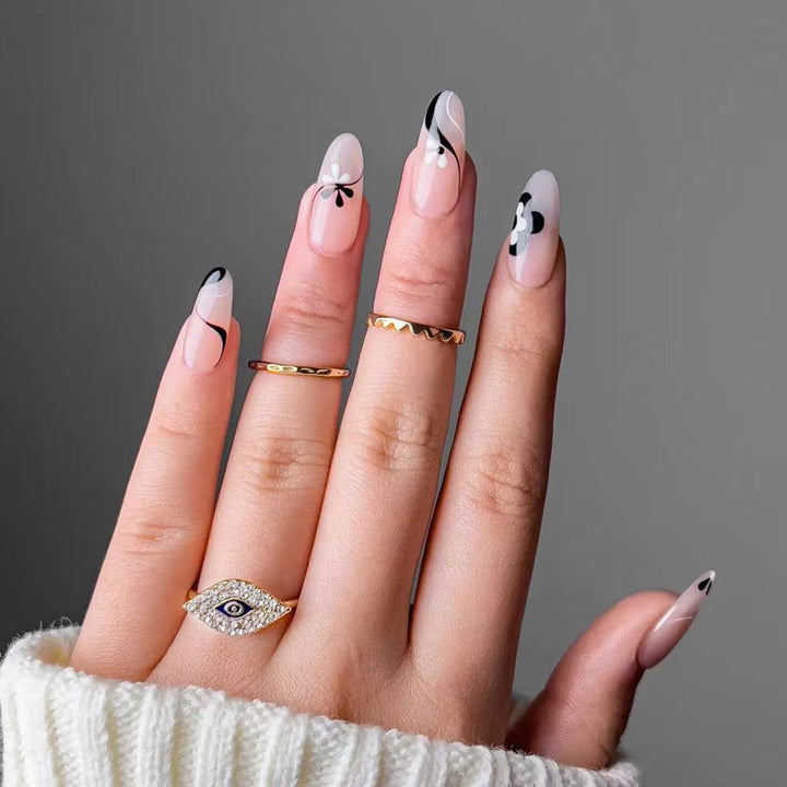 Artful nail extensions with an elegant leaf pattern Stornfield