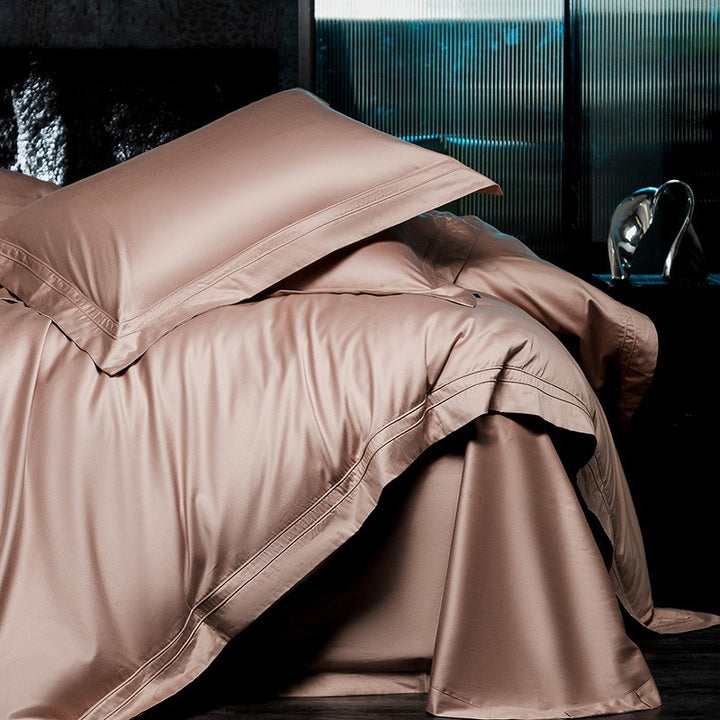 Exclusive cotton satin bedding set with a silky touch, double seam piping, and hotel closure