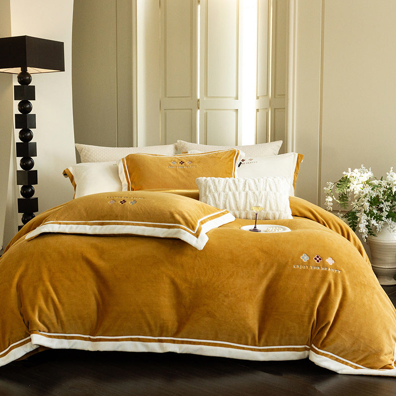 Velvety duvet cover set with embroidered floral design and contrasting piping