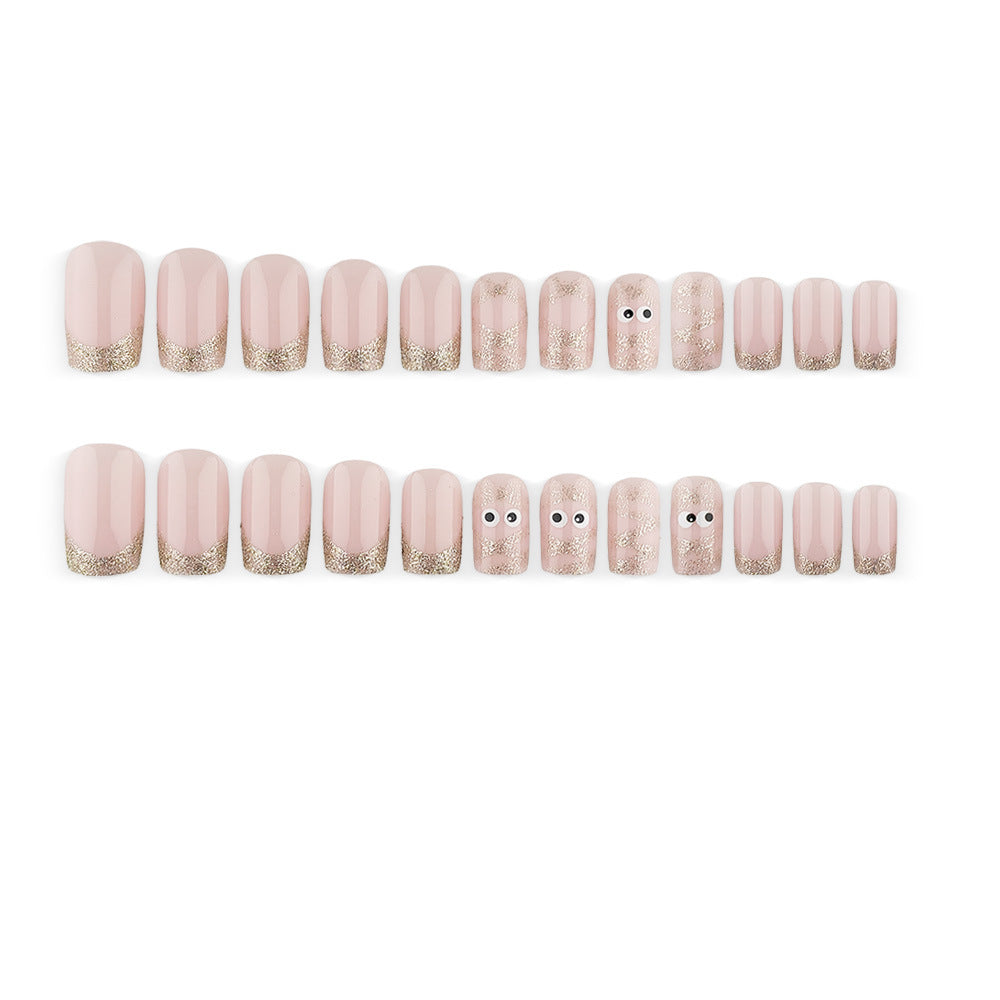 Artificials nails with playful eye design and glitter tips Stornfield