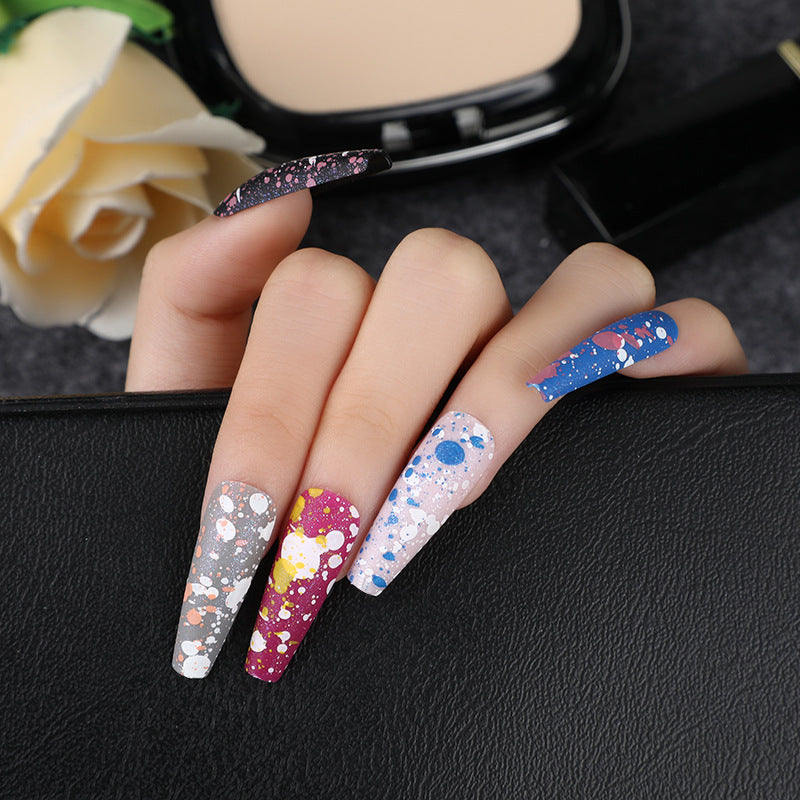 Artistic splatter design artificial nails Stornfield