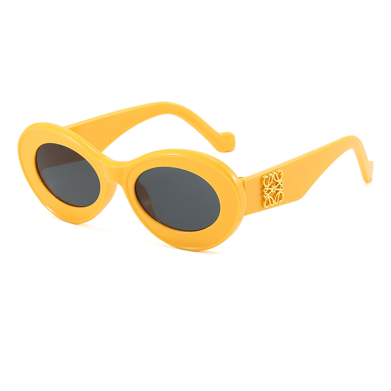 Women's fashionable sunglasses with oval frame and golden applications Stornfield
