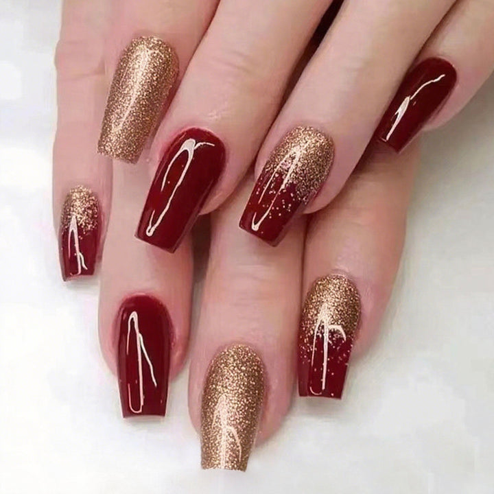 Glamorous artificial nails with glitter and elegant embellishments Stornfield