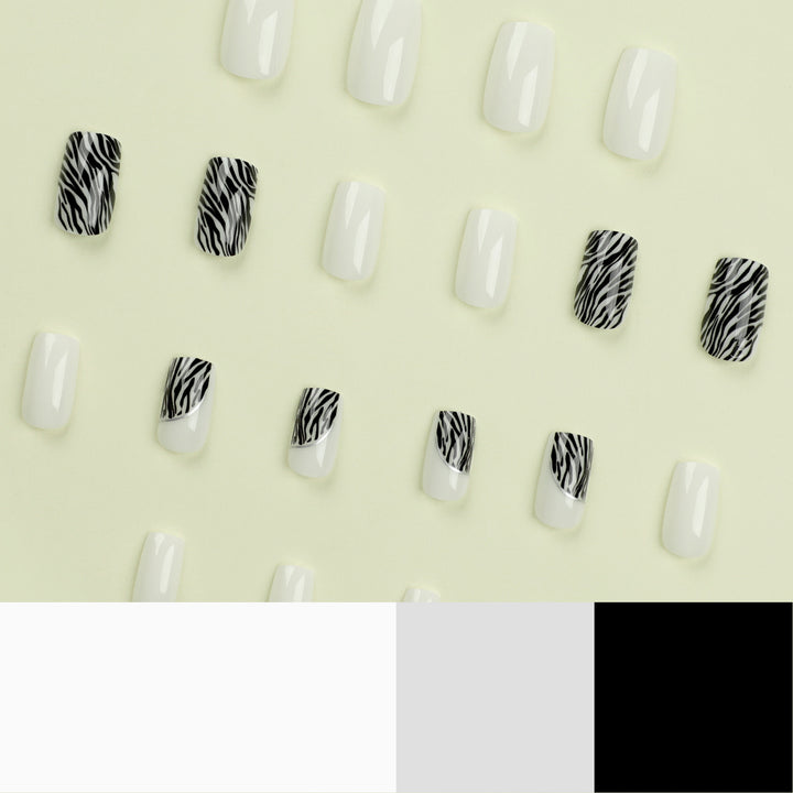 Artful nail extensions with stylish zebra pattern Stornfield
