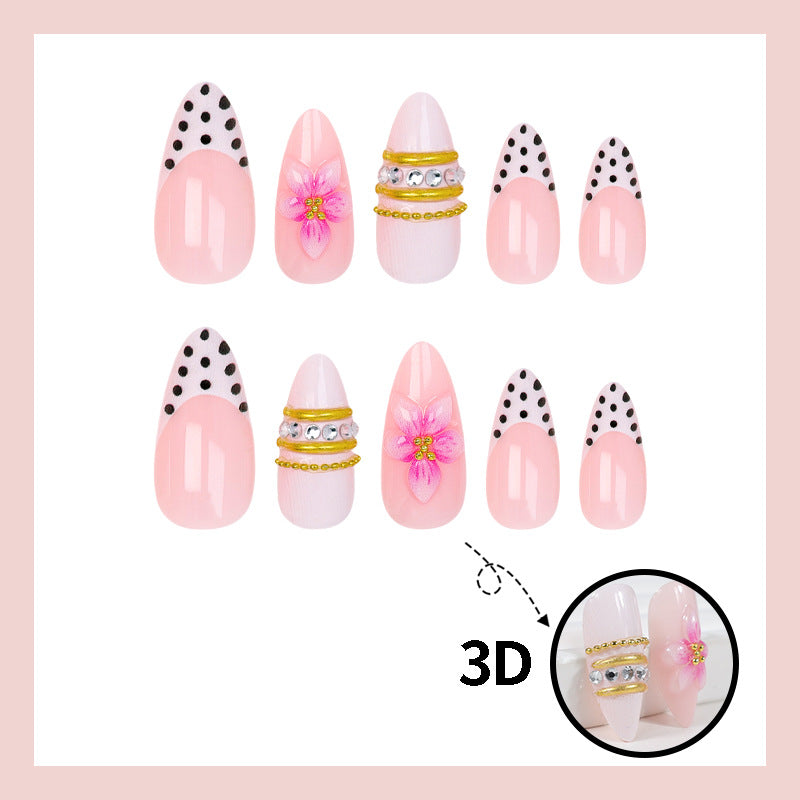 Acrylic nail set with romantic floral patterns and elegant glitter decorations Stornfield