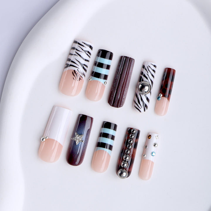 Artificial nails in modern striped design with 3D decoration Stornfield