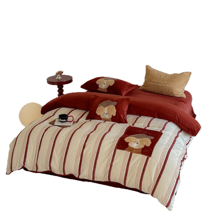 Plush bedding set with embroidered dog motif and striped cuddle blanket