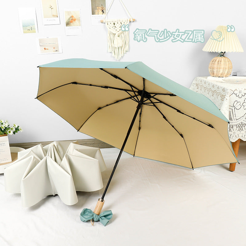 Women compact folding umbrella with stylish design and practical carrying strap Stornfield