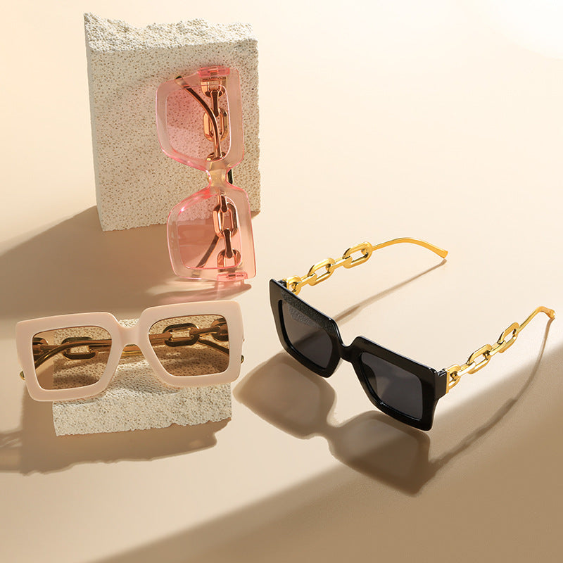 Women's fashionable sunglasses with unique rectangular frame and chain details Stornfield