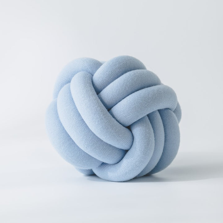 Decorative knitted knot cushion as a decorative pillow made of soft jersey