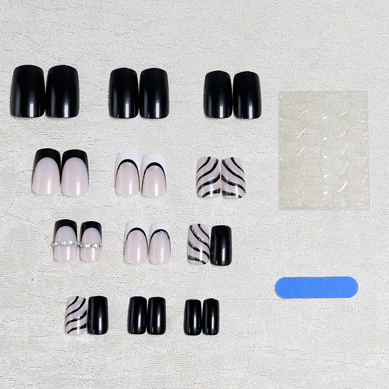 Artificial nail set with glamorous glitter and stripe designs Stornfield