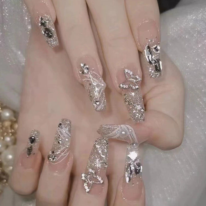 Elegant nail design with pearl embellishment Stornfield