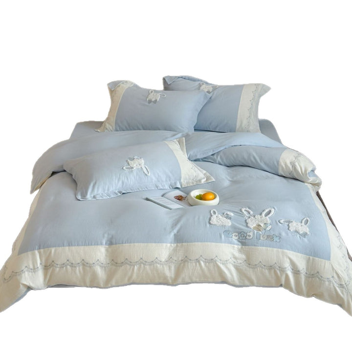 Embroidered cotton satin bedding set with appliquéd rabbit designs and decorative border