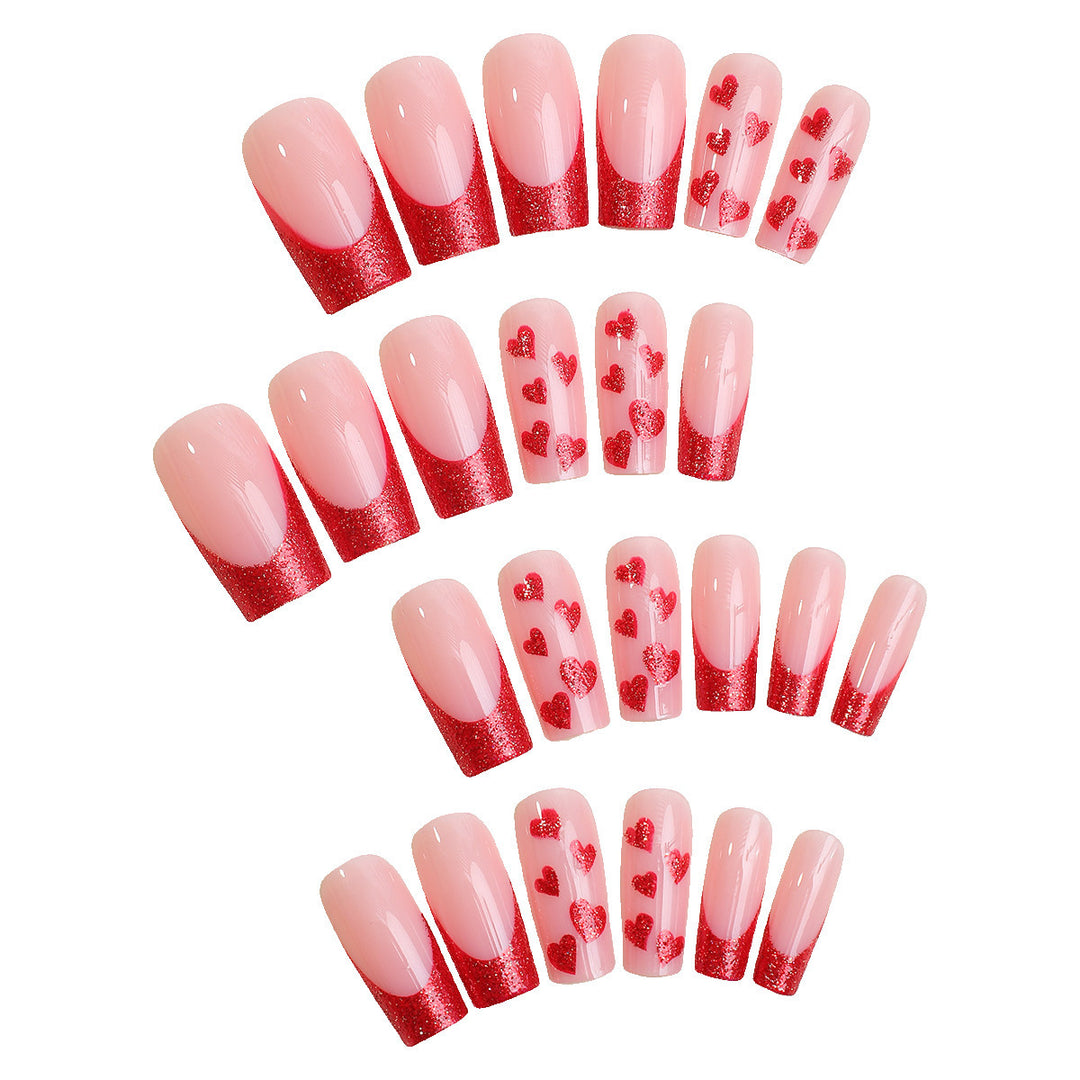 Acrylic nail set with glamorous heart designs and glitter accents Stornfield