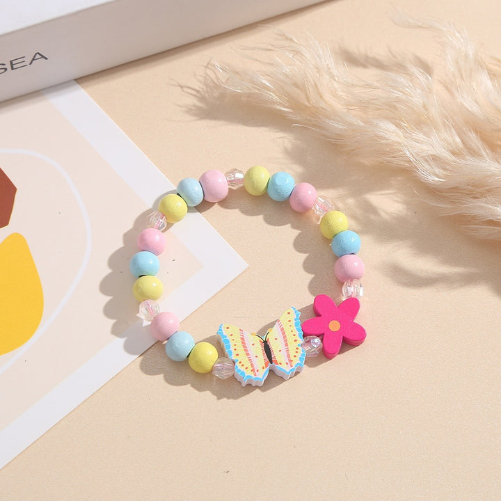 Playful bracelet with heart and butterfly charms Stornfield
