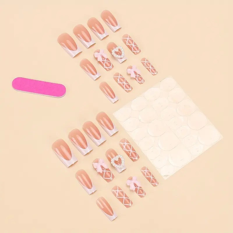 Elegant artificial nail tips with heart and bow accents Stornfield