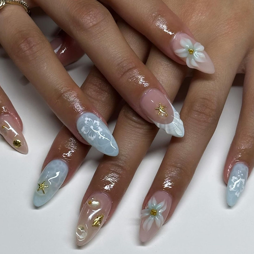 Elegant nail art in maritime design with glitter and 3D accents Stornfield