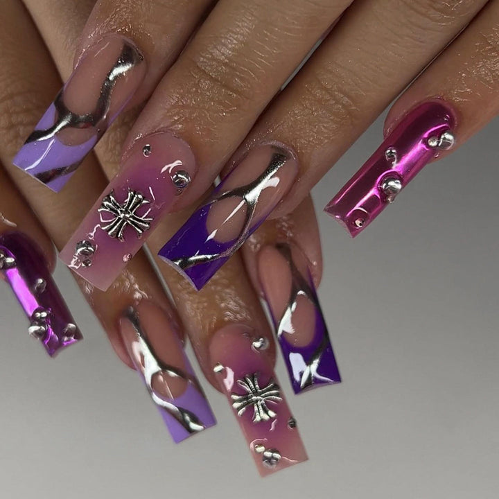 Artistic nail extensions with glitter and flower motifs Stornfield