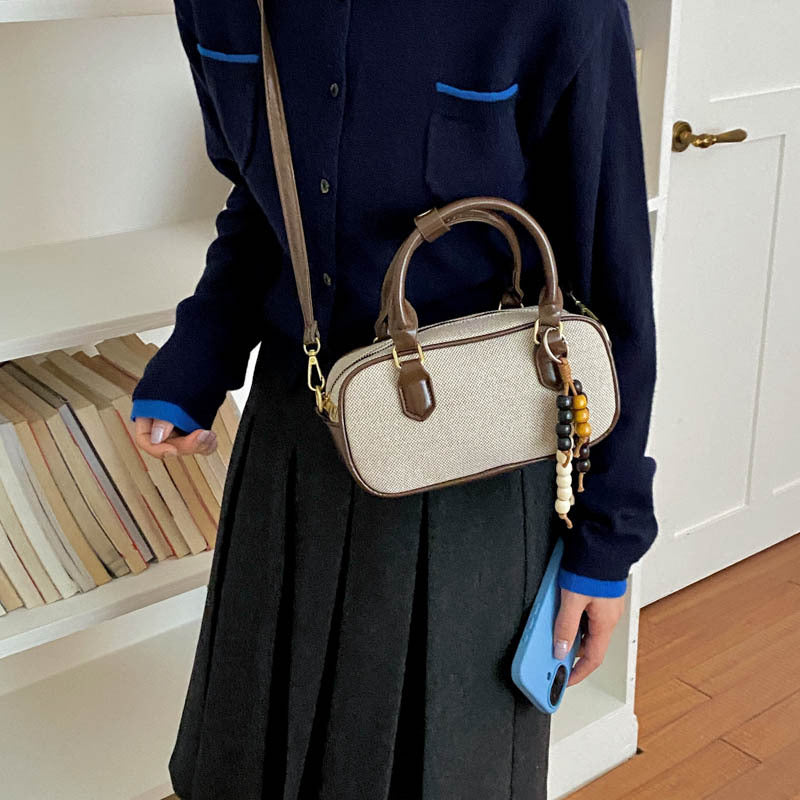 Vintage-Inspired Glossy Handheld Satchel