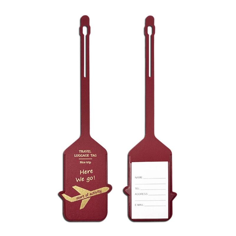 premium leather travel luggage ID tag with embossed airplane motif and adjustable strap Stornfield