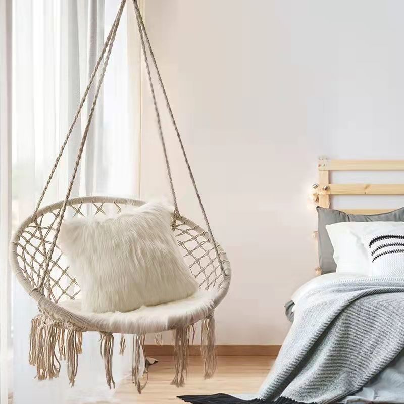 Boho macrame hanging swing chair with faux fur cushion and fringe Stornfield