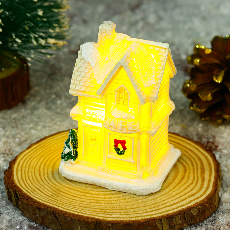 Illuminated Christmas village house with festive decoration Stornfield