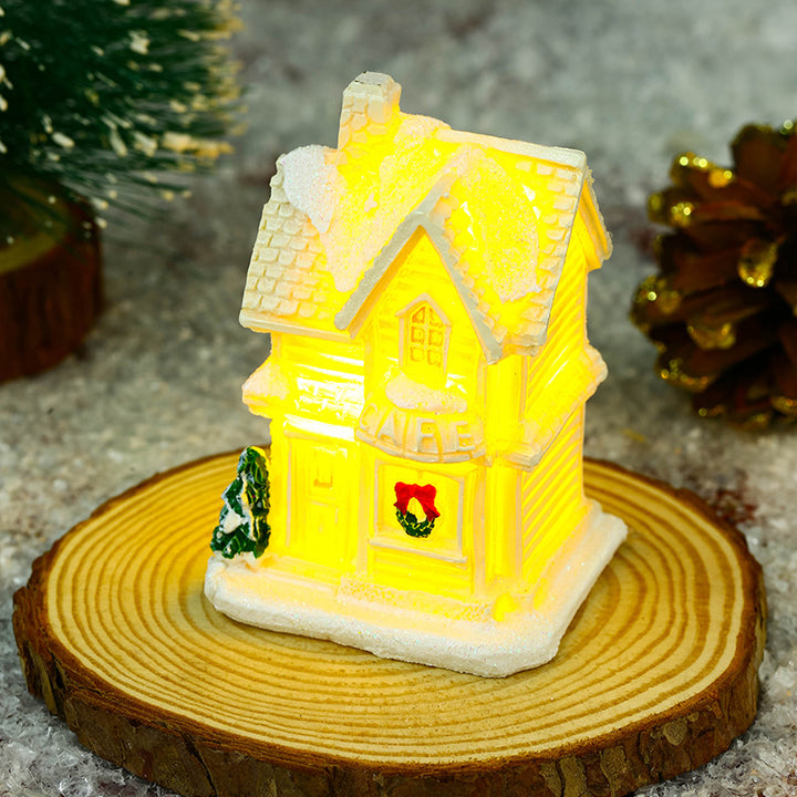 Illuminated Christmas village house with festive decoration Stornfield